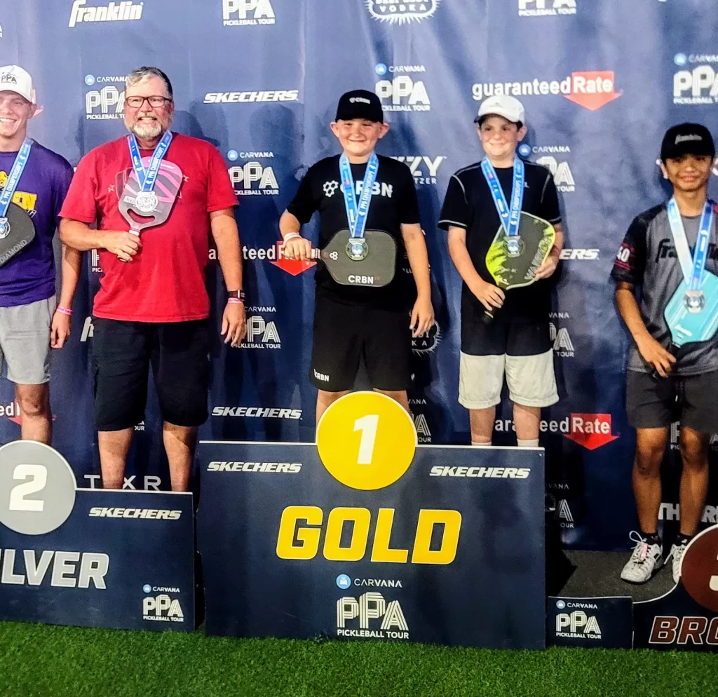 Jett on the podium taking gold in Men's Doubles 3.0 PPA Las Vegas