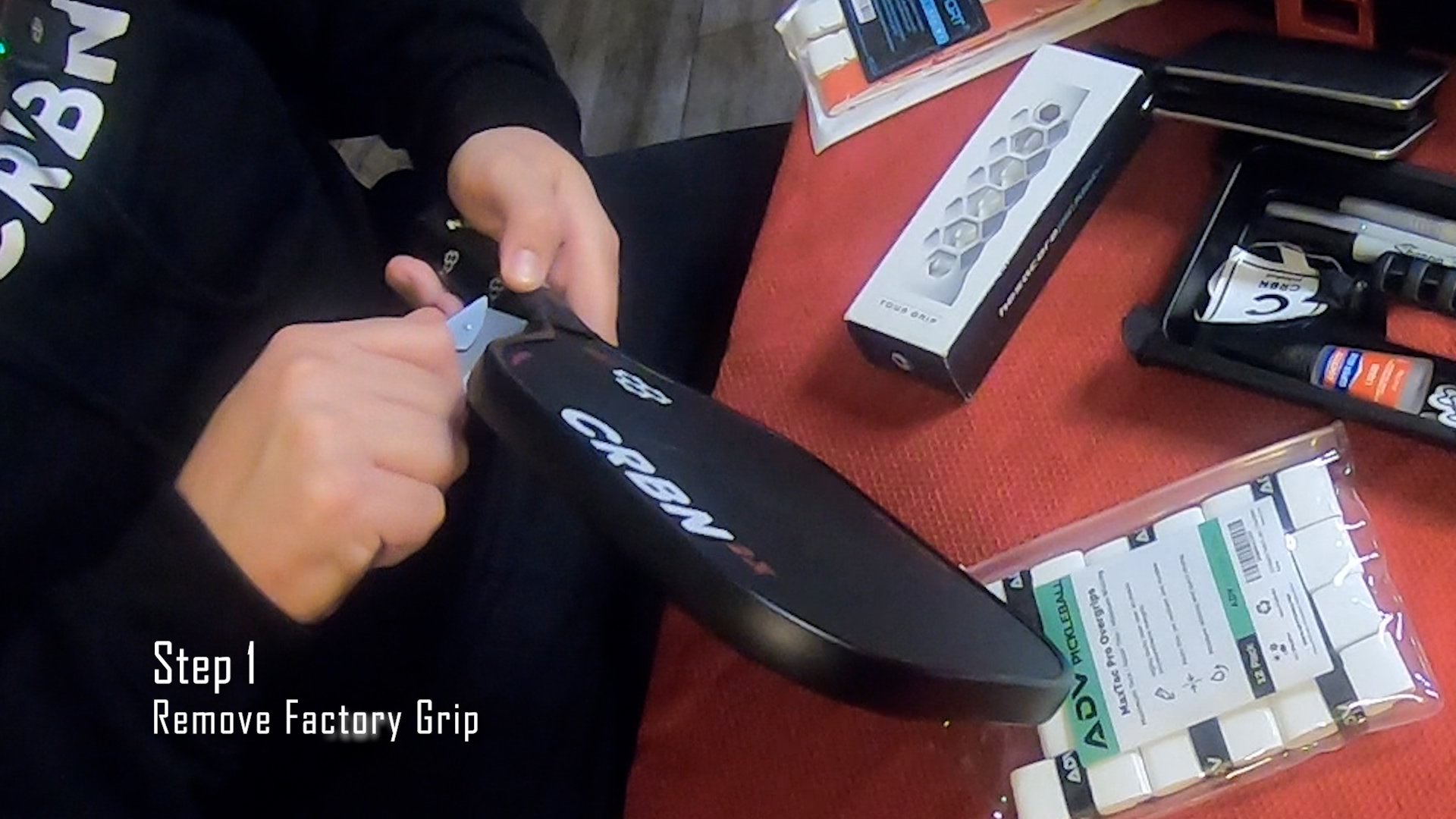 To remove a factory grip, nick the top of the grip with a box cutter or craft knife